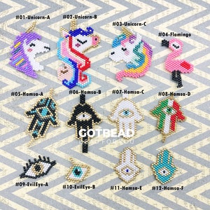 May include: A collection of 12 colorful beaded charms, including unicorns, flamingos, hamsa hands, and evil eyes. The charms are all made with small beads and have a variety of colors and designs.