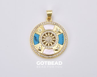 May include: Gold pendant with a round design featuring a turquoise and white shell inlay. The pendant is surrounded by a circle of clear rhinestones.