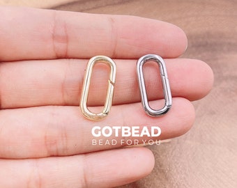 Delikatny złoty pierścień sprężynowy, pierścień z bramką typu push, pierścień owalny 23 x 11 mm, zapięcie sprężynowe typu push wypełnione złotem, zapięcie owalne z blokadą, CL526