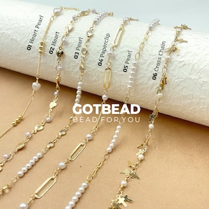 May include: Six different pearl necklaces with gold accents. The necklaces feature heart, paperclip, and cross charms. The text "GOTBEAD BEAD FOR YOU" is visible in the center of the image.