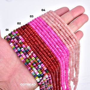 May include: A hand holding strands of colorful beads. The beads are in various shades of pink, red, and white. The beads are arranged in rows, with the numbers 01, 02, 03, and 04 labeling each row. The text "GOTBEAD BEAD FOR YOU" is visible at the bottom of the image.