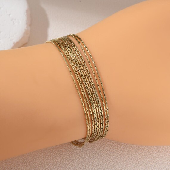 ゴールドブレスレットセット Infinity yellow gold bracelet with diamonds | Georg Jensen