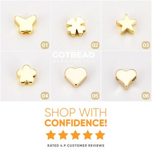 May include: A collection of six gold-toned metal beads in various shapes including a butterfly, four-leaf clover, star, flower, and two hearts. The image includes the text GOTBEAD BEAD FOR YOU, SHOP WITH CONFIDENCE!, and five orange stars.