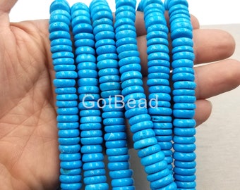 May include: Strands of bright turquoise disc-shaped beads. The beads are uniform in size and shape, with a slightly irregular texture. The image includes the text "GotBead". These beads are suitable for jewelry making.