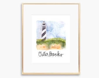 May include: A watercolor painting of a black and white striped lighthouse on a grassy hill with the text "Outer Banks" below. The sky is blue with white clouds.