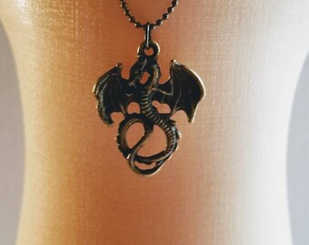 Doll size necklace with antique gold dragon.