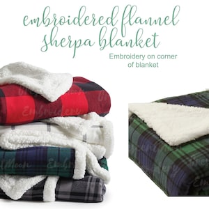 May include: A stack of four plaid flannel sherpa blankets with white sherpa lining. The blankets are folded and stacked, with the red and black plaid blanket on top. The text "Embroidered flannel sherpa blanket" is written above the image. The text "Embroidery on corner of blanket" is written below the image.