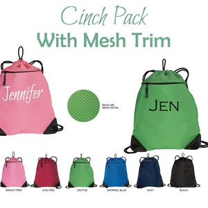 May include: A drawstring bag with a mesh trim and a zippered pocket. The bag is available in a variety of colors, including bright pink, chili red, cactus green, snorkel blue, navy, and black. The bag is personalized with the name "Jennifer" in white lettering.