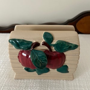 Ceramic napkin holder.