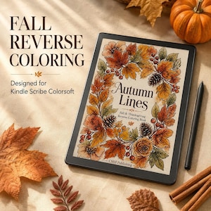 May include: A digital tablet displaying a Fall Reverse Coloring book titled Autumn Lines, featuring a wreath of autumn leaves, pinecones, and berries. The screen shows the text Fall Reverse Coloring Designed for Kindle Scribe Colorsoft.