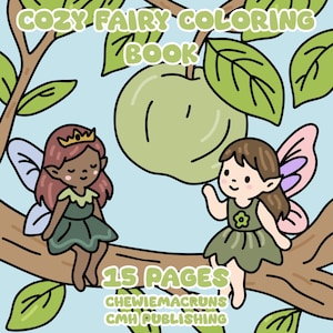 May include: A children's coloring book cover with the text "Cozy Fairy Coloring Book." Two cartoon fairies with wings sit on a tree branch. A large green apple and leaves are in the background. The book has 15 pages.