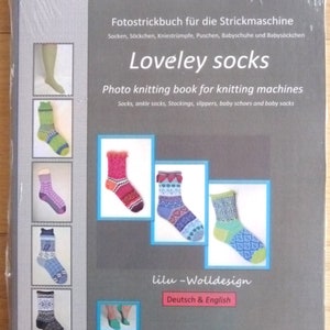 May include: A book titled "Sockenliebe: Loveley socks" with a photo of colorful knitted socks on the cover. The book is a photo knitting book for knitting machines and includes instructions for socks, ankle socks, stockings, slippers, baby shoes, and baby socks. The book is written in German and English and is for knitting machines with 4.5 mm needles.
