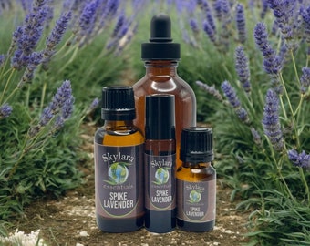 May include: Three amber glass bottles of Skylara Essentials Spike Lavender oil. The largest bottle has a black dropper cap, the middle is a roller bottle, and the smallest has a black screw cap. Each label features a globe logo and text.