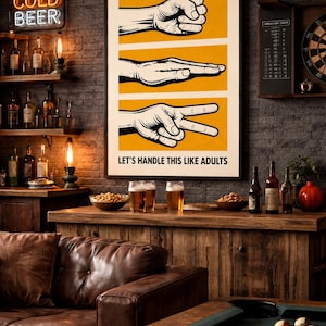 May include: A framed rectangular wall poster featuring three horizontal yellow panels, each displaying a black and white illustration of a hand gesture representing rock, paper, and scissors. Below the illustrations, the text reads LET'S HANDLE THIS LIKE ADULTS in a bold, black, sans-serif font.