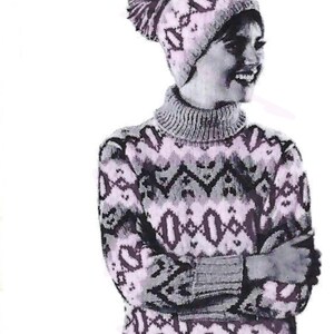 May include: A woman wearing a pink and black patterned sweater and matching hat. The sweater has a turtleneck and long sleeves. The hat has a pom-pom on top.