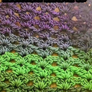 May include: Close-up of a crocheted fabric with a gradient of colors. The top is a vibrant green, transitioning through shades of blue and purple. The text "LOOK HOW BEAUTIFUL" is displayed in a white font with a black outline.