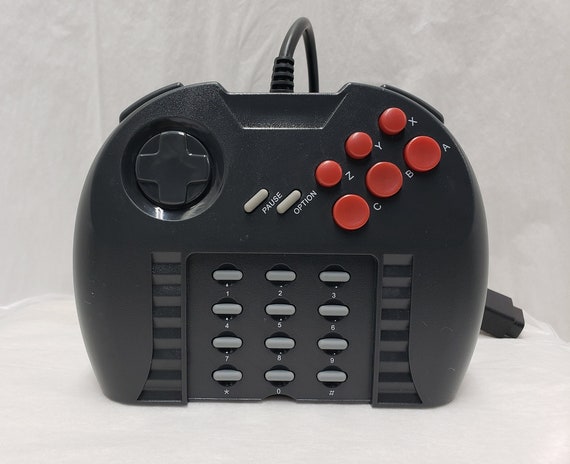 Atari jaguar. Atari yaguar. Джойстик Атари Ягуар. Атари 2000 геймпад. Джойстик гепард для Atari.