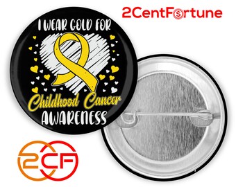 May include: A black button with the text "I Wear Gold For Childhood Cancer Awareness" and a yellow ribbon design. The button has a white heart and yellow heart accents. The back of the button is silver.