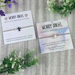 May include: Two silver bracelets with angel charms and cards that read "Worry Angel" and include messages about wearing the bracelet to help calm anxiety.