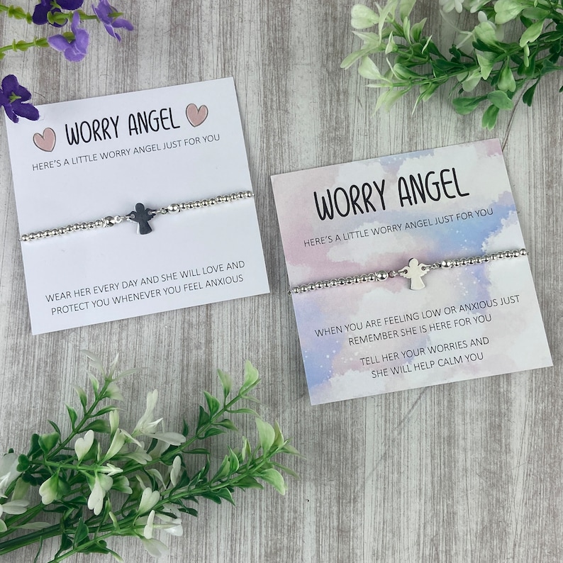May include: Two silver bracelets with angel charms and cards that read "Worry Angel" and include messages about wearing the bracelet to help calm anxiety.