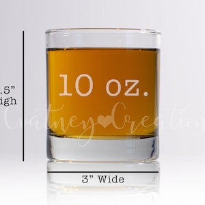 May include: A clear glass 10 ounce whiskey tumbler with a heart etched on the front. The tumbler is 3.5 inches high and 3 inches wide.