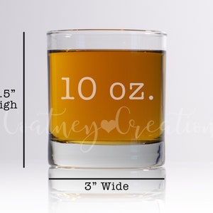 May include: A clear glass 10 ounce whiskey tumbler with a heart etched on the front. The tumbler is 3.5 inches high and 3 inches wide.