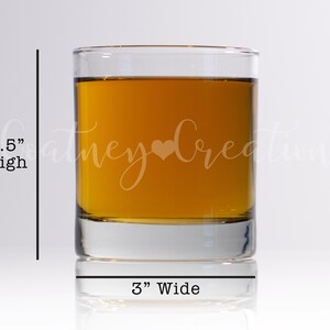May include: A clear glass tumbler with a 3.5 inch height and 3 inch width. The tumbler is filled with a golden liquid and has the text "Coney Creations" etched on the side.