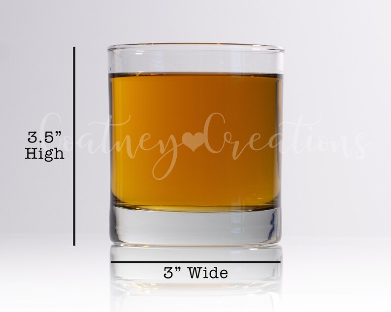 May include: A clear glass tumbler with a 3.5 inch height and 3 inch width. The tumbler is filled with a golden liquid and has the text "Coney Creations" etched on the side.