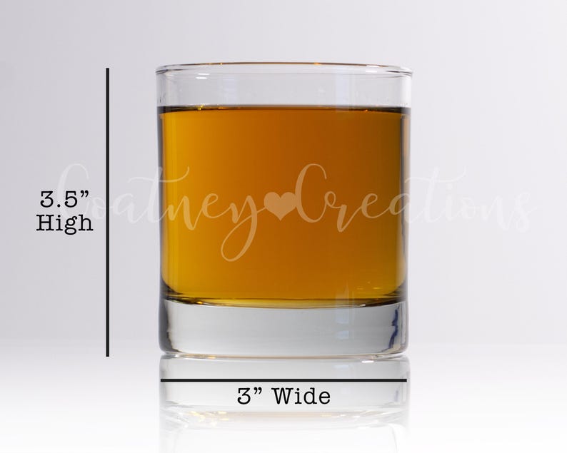May include: A clear glass tumbler with a height of 3.5 inches and a width of 3 inches. The tumbler is filled with a golden liquid and has the text "Coney Creations" etched on the side.