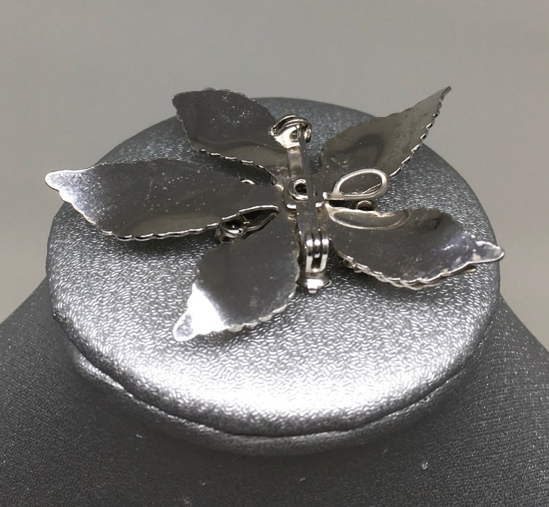 Floral broochpendant of rhinestone and silver
