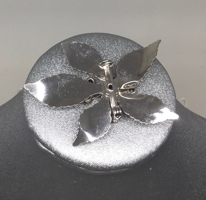 Floral broochpendant of rhinestone and silver