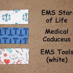 May include: Three different headband designs with medical symbols. The top headband is white with blue star of life symbols. The middle headband is blue with white caduceus symbols. The bottom headband is white with red and blue medical tools.