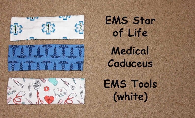 May include: Three different headband designs with medical symbols. The top headband is white with blue star of life symbols. The middle headband is blue with white caduceus symbols. The bottom headband is white with red and blue medical tools.