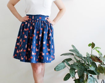 Oriana Skirt - Curled cotton skirt with waist band, pink llama on a blue background print