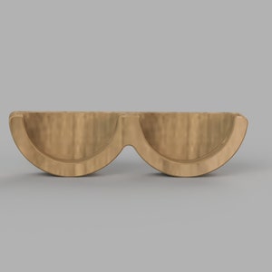 May include: A wooden stand with two half-circle shaped compartments. The stand is made of light brown wood and has a smooth finish.