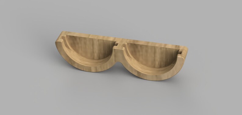 May include: A wooden, two-piece, half-circle shaped mold for making soap or candles.