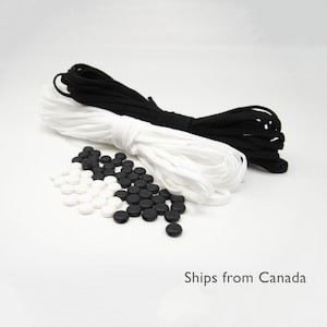 May include: Two spools of elastic cord, one black and one white, with a pile of black and white round plastic cord stoppers.