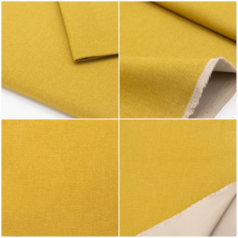 May include: Close-up of a yellow fabric with a textured weave. The fabric is folded in half, showing the underside of the fabric, which is a light beige colour.