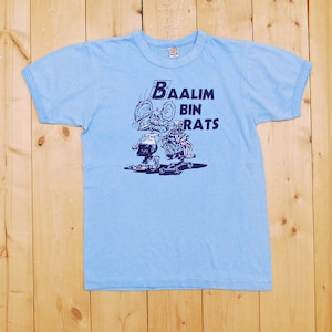 May include: A light blue t-shirt with a graphic of two cartoon rats skateboarding. The text "Baalim Bin Rats" is printed on the shirt.