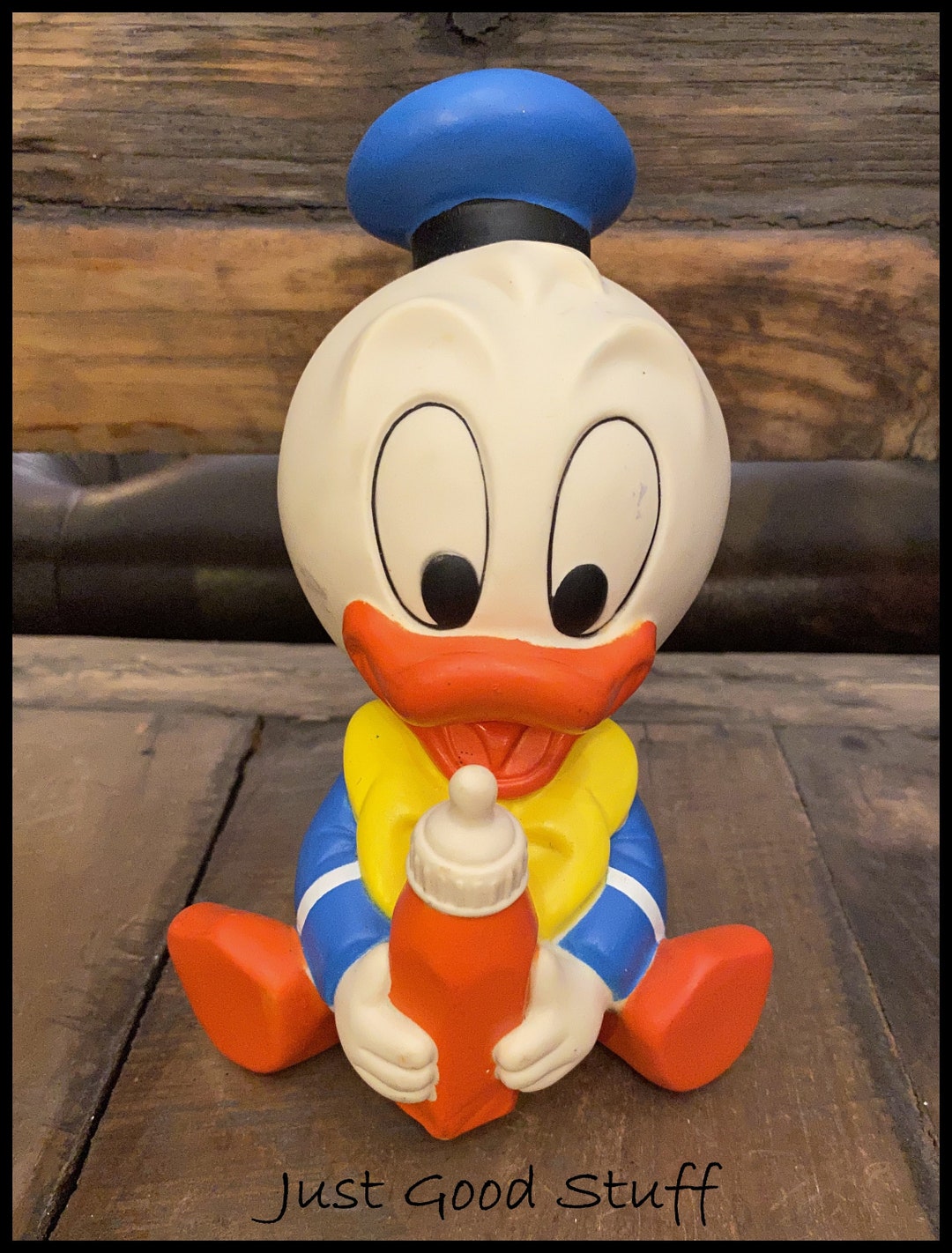 Vintage Walt Disney Baby Donald Duck Rubber Holding a Baby Bottle Toy