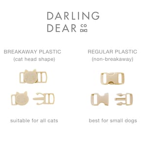 May include: Beige plastic breakaway and regular buckles for pet collars. The breakaway buckle is cat-shaped and suitable for all cats. The regular buckle is best for small dogs. The text "DARLING DEAR CO" is at the top.