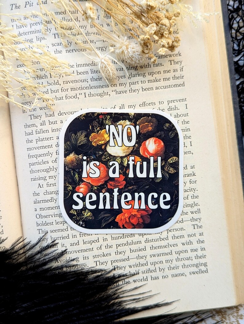 Op de afbeelding: Een sticker met een zwarte achtergrond en een kleurrijk bloemenontwerp. De tekst "NO" staat in witte letters en de tekst "is a full sentence" staat in witte letters met een zwarte omtrek.