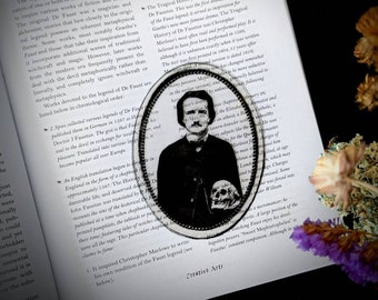 May include: A black and white illustration of a man holding a skull. The illustration is framed in a circle with a decorative border. The text "The Tragical History of Dr Faustus" is printed on the page.