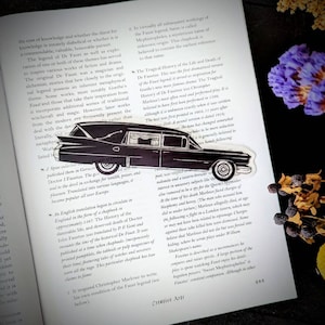 May include: A black and white illustration of a vintage hearse with a text overlay about the history of the legend of Faust. The text includes the words "The Faust Legend" and "The History of the Life and Death of Dr. Faust."