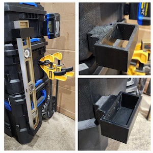 May include: Black tool storage system with blue accents, featuring a level, clamps, and a battery. The system includes a 3D-printed black storage bin. A blue and black battery is attached to the side.