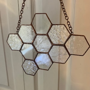 Atrapasol en forma de panal: acabado en cobre antiguo con textura transparente o plata brillante