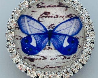 Carrete de insignia de mariposa