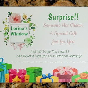 May include: A gift card with the text "Surprise!! Someone Has Chosen A Special Gift Just for You". The card features a floral design with the text "Lorina's Window" and illustrations of wrapped gifts.
