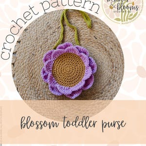 May include: A crochet pattern for a Blossom Toddler Purse. The purse is flower-shaped, with a brown center and purple petals. The strap is green. The text "crochet pattern" is arched above the purse, and "Blossom Toddler Purse" is below.
