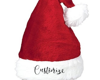 May include: Red and white Santa hat with a white fur trim. The hat has the word "Customize" written on the front in black.